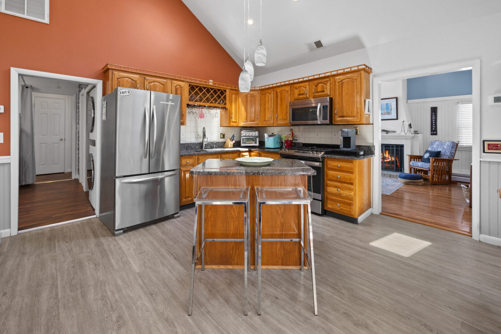 Modern kitchen with stainless steel appliances and wooden cabinetry.