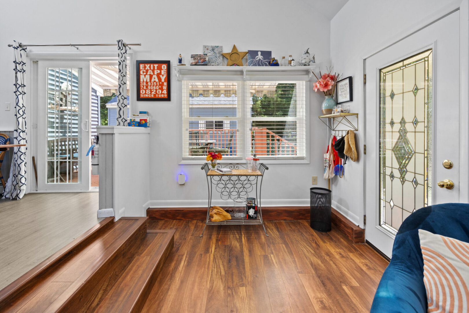 Bright kitchen nook with wooden floors and a window view.